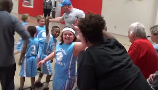 [WATCH NOW] 8-year-old sinks half-court shot in recreation league basketball game