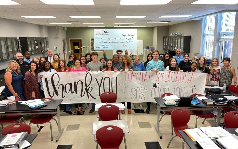 Sylacauga High School students honor Toyota of Sylacauga and SCS Foundation at sales check presentation
