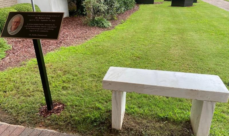 Community gathers at B.B. Comer Memorial Library to honor Dr. Robert Gray with bench dedication